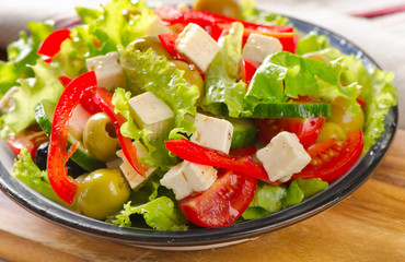 Greek  salad with feta  and vegetables .