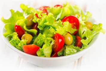 Fresh  vegetables salad in  white bowl.