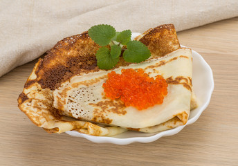 Pancakes with red caviar
