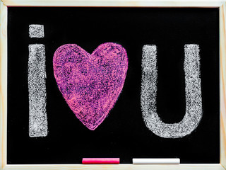 I love you message hand written with chalk on blackboard