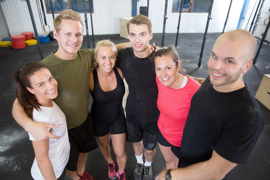 Happy fitness workout team at the gym