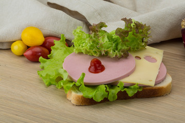 Sandwich with cheese and sausages