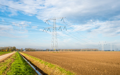 Plowed farmland and high voltage lines