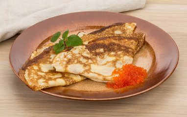 Pancakes with red caviar