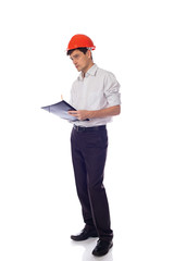Man in a shirt orange construction helmet writes black folder