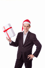 man suit and hat with Christmas gift in hand on white backgro