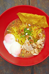close up thai spicy pork noodle in red cup