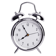 Five minutes to eight on a round alarm clock