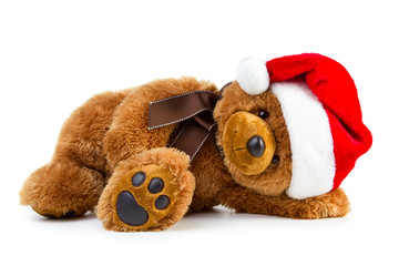 Toy teddy bear wearing a santa hat