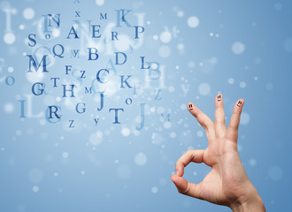 Happy smiley fingers looking at mixture of bokeh letters