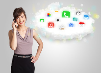 Young woman presenting cloud with colorful app icons and symbols