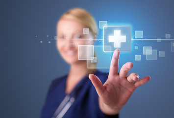 Young nurse pressing modern medical type of buttons