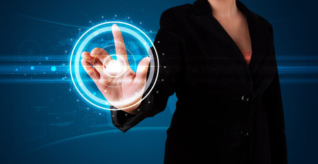 Woman pressing high tech type of modern buttons
