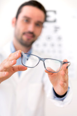 Ophthalmologist make you try new glasses