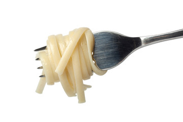 Cooked linguine coiled around a fork isolated