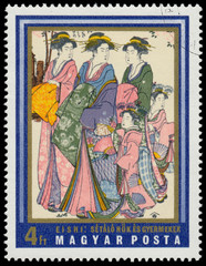 Stamp printed in Hungary shows walking women and children