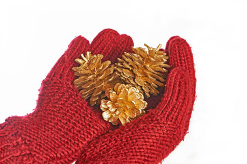 Gold cones in the hands in red gloves