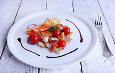 Fresh fish salad with vegetables