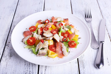 Fresh fish salad with vegetables