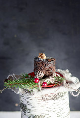 Christmas chocolate cupcake on birch stump.