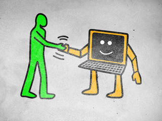 Pop art of a human figure shaking hand with computer