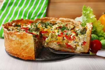 Vegetable pie with broccoli, peas, tomatoes and cheese