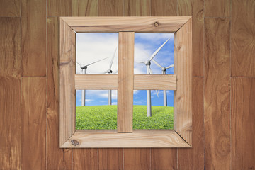 see wind power station through wooden window