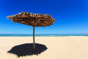 Fototapeta premium Wooden sun umbrella on the beach in Thailand