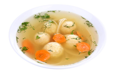 Soup with meatballs and noodles in bowl isolated on white
