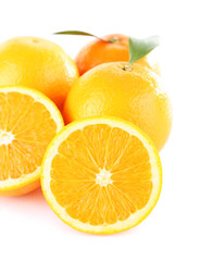 Ripe tangerines and oranges with leaves isolated on white