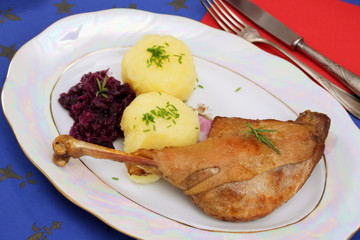 Roasted goose leg with red cabbage and dumplings