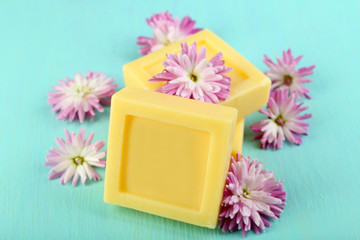 Bars of natural soap and fresh flowers