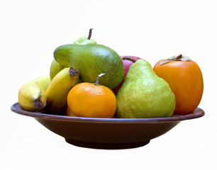 Different colorful fruits on the plate isolated