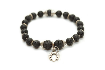 Bracelet with stones and silver pendant shaped like a horseshoe