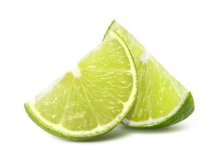 Two quarter lime pieces isolated on white