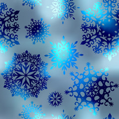 Fototapeta na wymiar Snowflakes on blue blur background.
