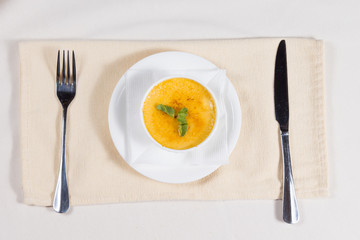 Bowl of delicious spicy pumpkin soup