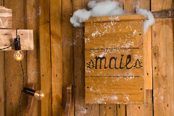 Old wooden mailbox in a snowy day of winter