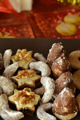 Various Christmas Cookies On The Brown Plate