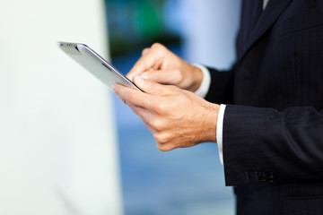Businessman using his digital tablet