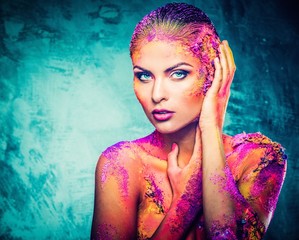 Beautiful young woman with conceptual colourful body art