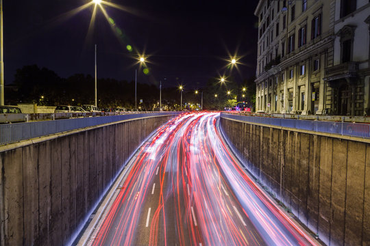 Car Traffic At Night In Rome