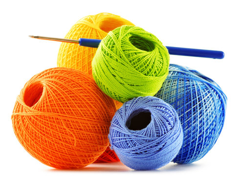 Colorful yarn for crocheting and hook isolated on white