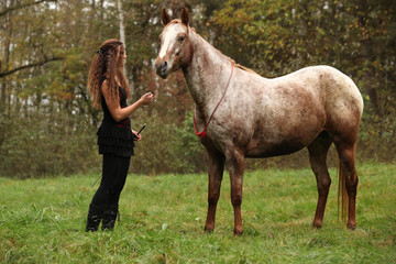 Young girl working with horse, natural horsemanship