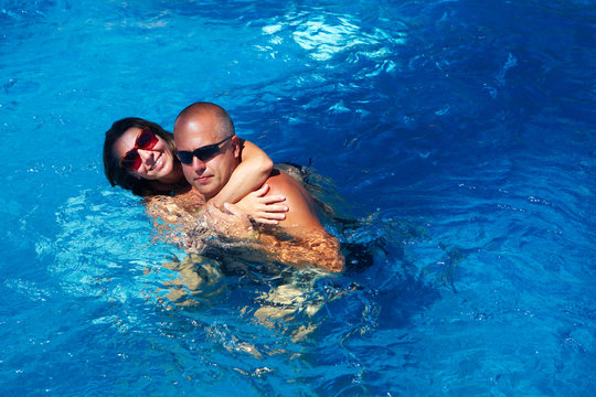 Happy couple in pool