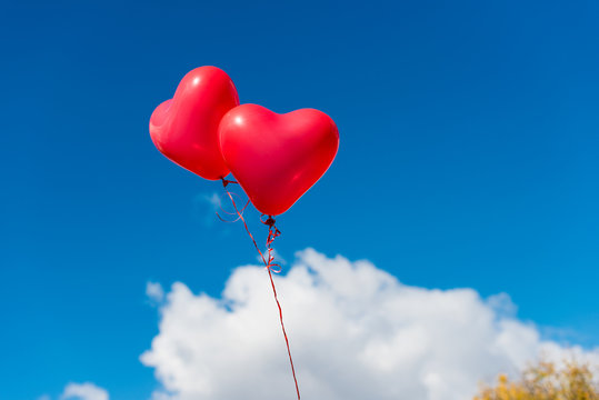Valentine heart balloon against blue sky background