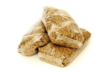 Three packs of buckwheat in transparent plastic bags