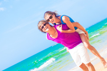 picture of happy couple in sunglasses on the beach