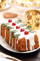 Christmas holly fruitcake on the table