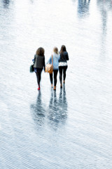 A young women walking in rain